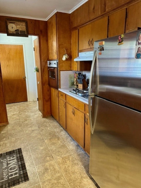 kitchen with ornamental molding, stainless steel appliances, and tasteful backsplash