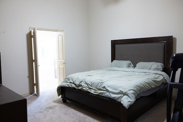 bedroom featuring light colored carpet