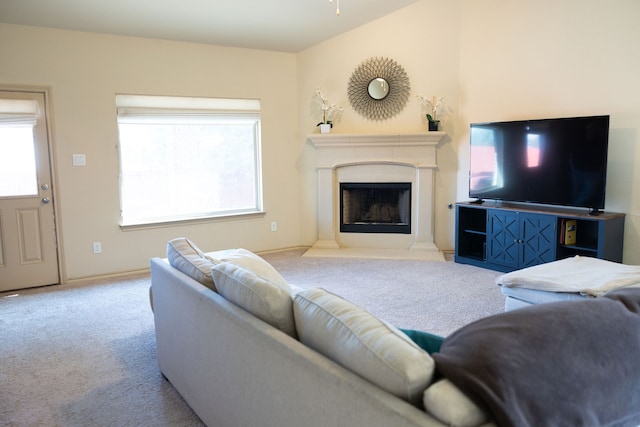 carpeted living room with ceiling fan