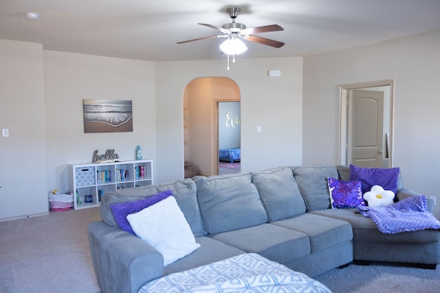 living room with carpet flooring and ceiling fan