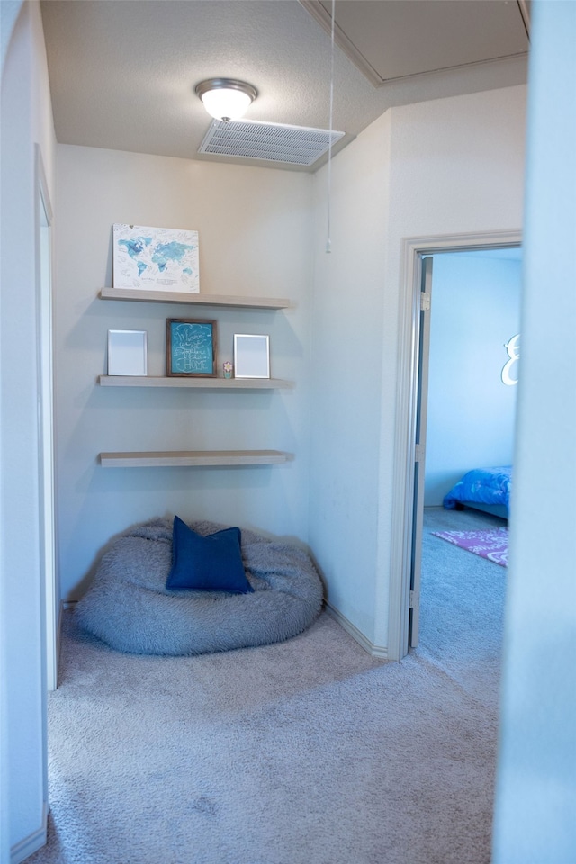 sitting room with carpet flooring