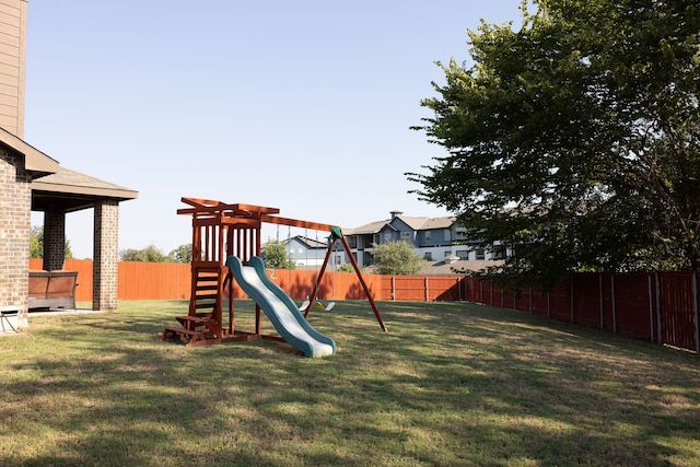 view of playground with a yard