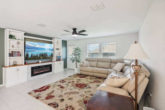 tiled living room with ceiling fan