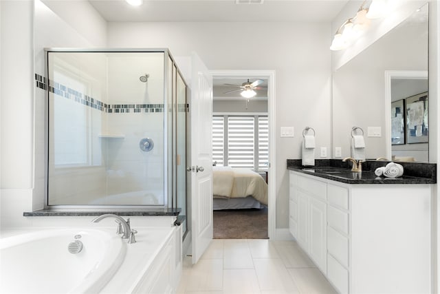 bathroom with tile patterned flooring, plus walk in shower, vanity, and ceiling fan