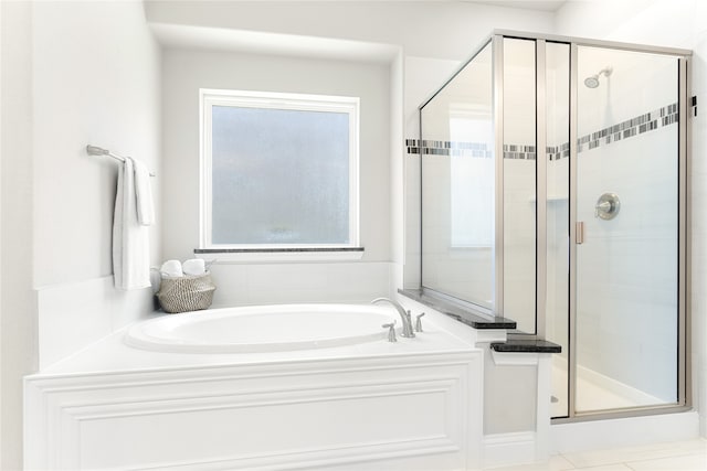 bathroom featuring independent shower and bath and tile patterned floors