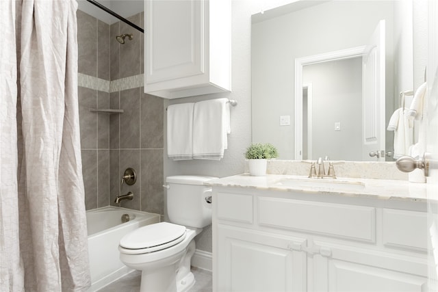 full bathroom with vanity, shower / tub combo, and toilet