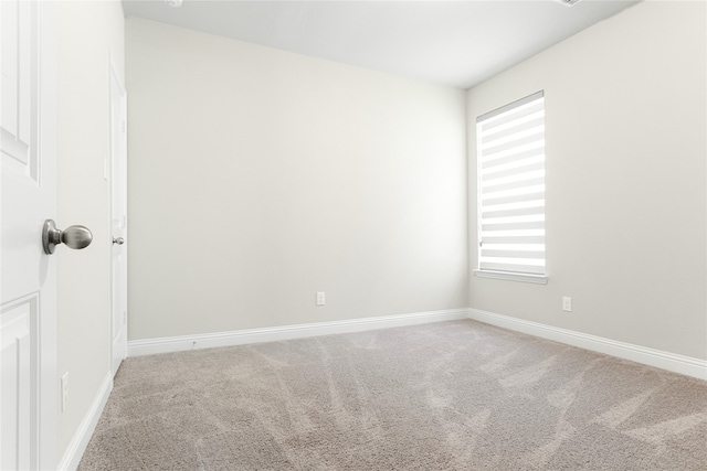 spare room with carpet and a healthy amount of sunlight