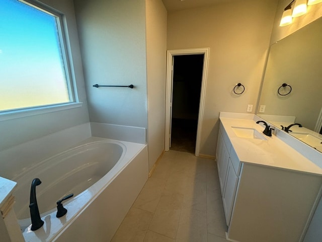 bathroom featuring a bath, vanity, and tile patterned floors