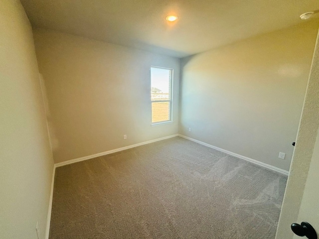 view of carpeted spare room