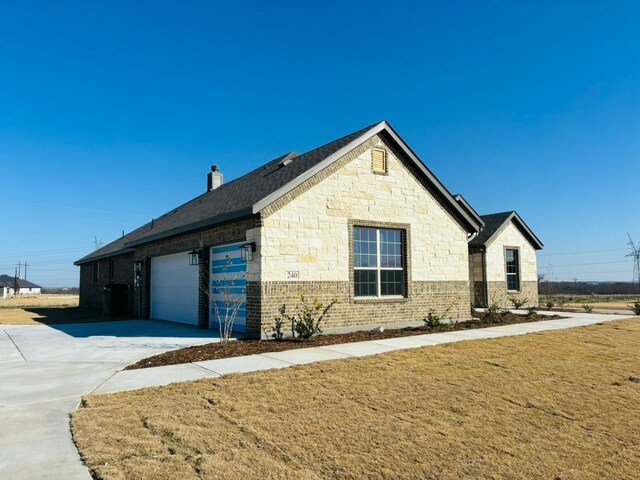 view of side of property featuring a garage