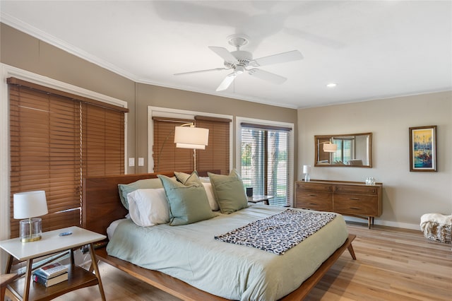 bedroom featuring ornamental molding, ceiling fan, light hardwood / wood-style floors, and access to outside