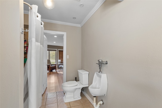 bathroom featuring ornamental molding, hardwood / wood-style floors, and toilet