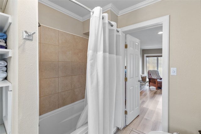 bathroom featuring shower / bath combo with shower curtain, crown molding, and hardwood / wood-style floors