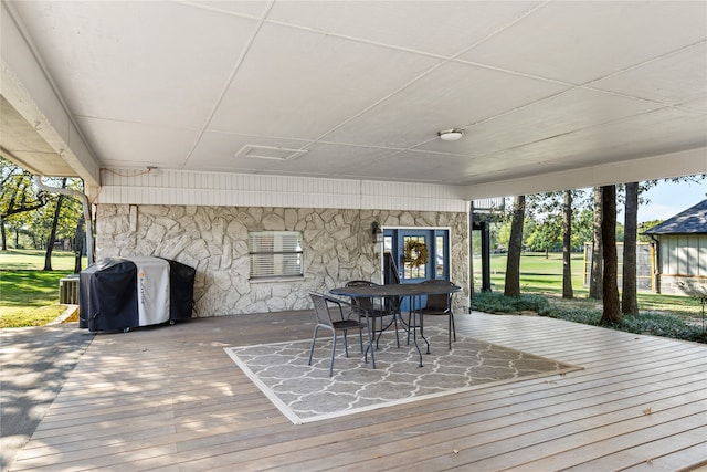 wooden deck with cooling unit and grilling area