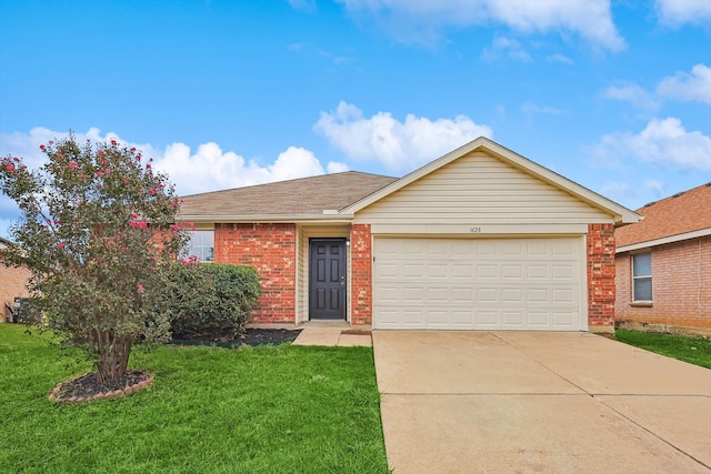 ranch-style home featuring a garage and a front lawn