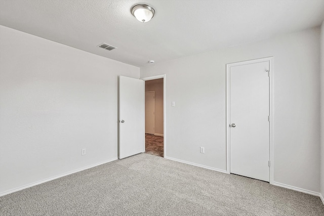 unfurnished bedroom with light carpet