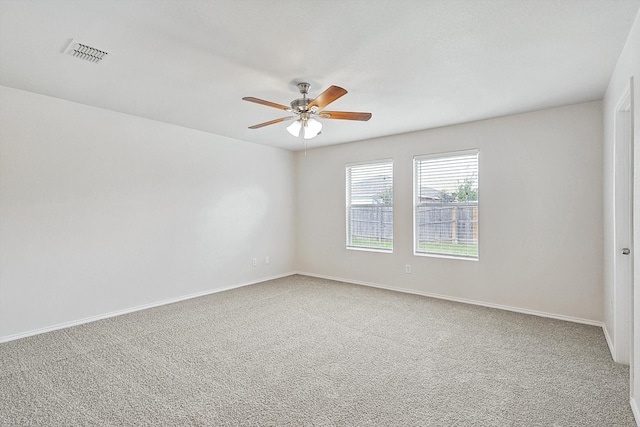 empty room featuring ceiling fan and carpet flooring