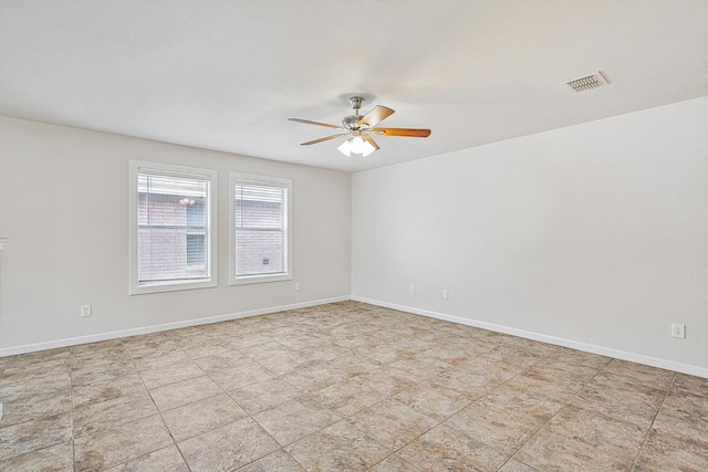 unfurnished room with ceiling fan