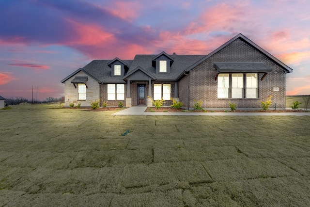 french provincial home with a yard