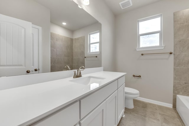 bathroom featuring toilet and vanity