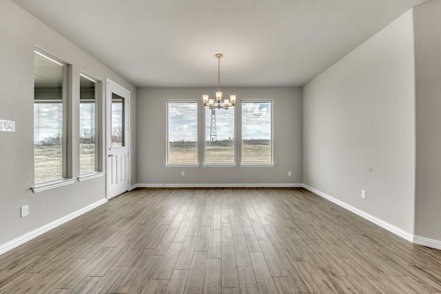 spare room featuring a notable chandelier