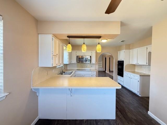 empty room featuring hardwood / wood-style floors and ceiling fan