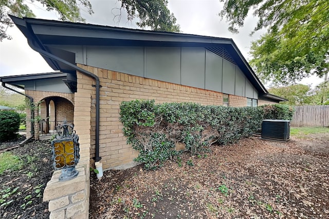 view of side of home featuring central AC unit