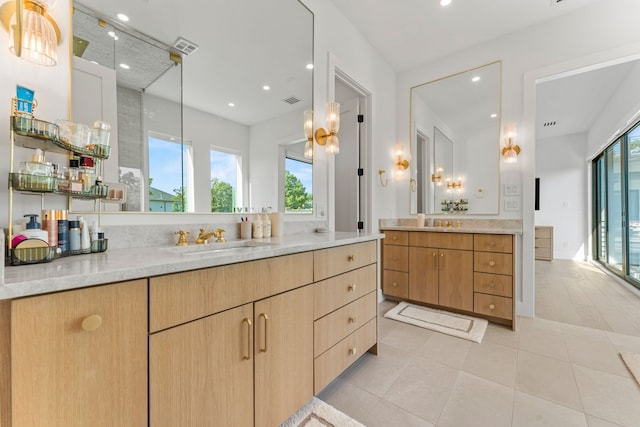 bathroom featuring tile patterned floors and vanity