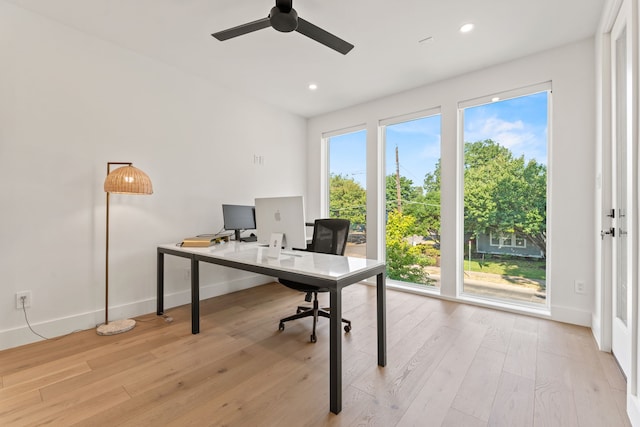 office area with ceiling fan and light hardwood / wood-style floors