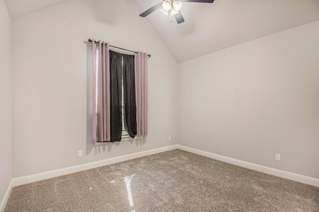 carpeted spare room with lofted ceiling and ceiling fan