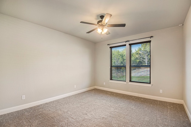 spare room featuring ceiling fan and carpet flooring