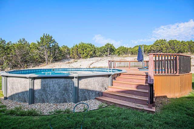 view of pool featuring a wooden deck