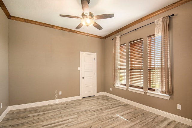 unfurnished room with ceiling fan, light hardwood / wood-style flooring, and ornamental molding