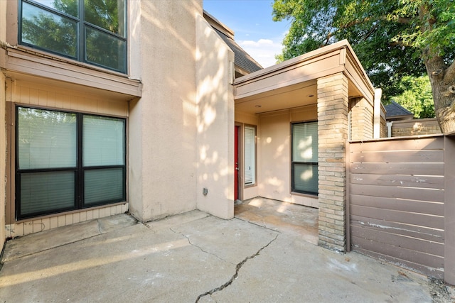 entrance to property featuring a patio