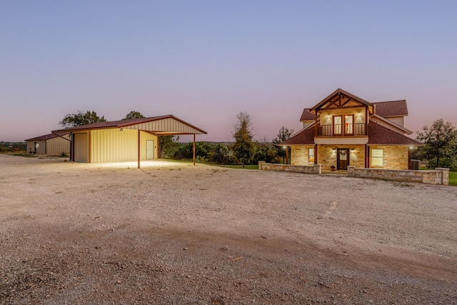 view of front of home with an outdoor structure and a garage