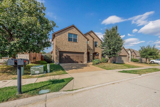 941 Lake Meadow Ln, Little Elm, TX 75068 - view of front of property featuring brick siding, a garage, and driveway
