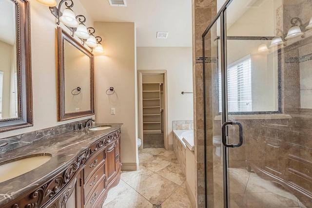 bathroom with tile patterned floors, vanity, and plus walk in shower