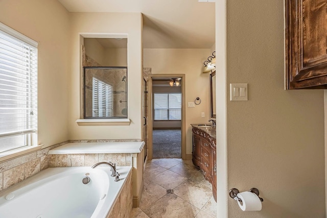 bathroom featuring tile patterned floors, vanity, and independent shower and bath