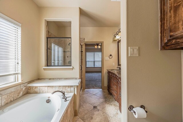 941 Lake Meadow Ln, Little Elm, TX 75068 - full bathroom featuring tile patterned flooring, a shower stall, a garden tub, and vanity