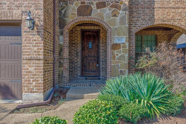 941 Lake Meadow Ln, Little Elm, TX 75068 - view of exterior entry featuring brick siding