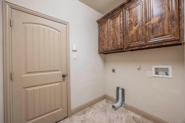 clothes washing area featuring hookup for a washing machine, hookup for a gas dryer, hookup for an electric dryer, and cabinets