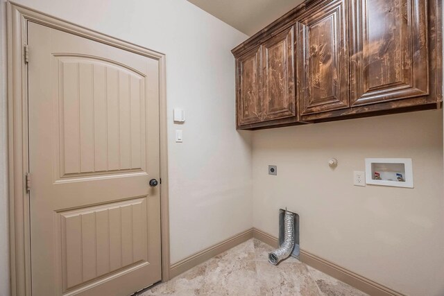 941 Lake Meadow Ln, Little Elm, TX 75068 - clothes washing area featuring baseboards, hookup for a washing machine, gas dryer hookup, electric dryer hookup, and cabinet space