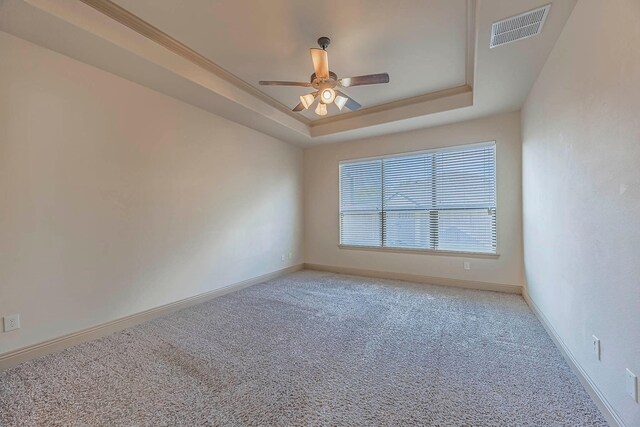 941 Lake Meadow Ln, Little Elm, TX 75068 - carpeted empty room featuring a raised ceiling, baseboards, a ceiling fan, and visible vents
