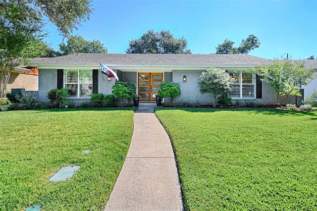 ranch-style house featuring a front lawn