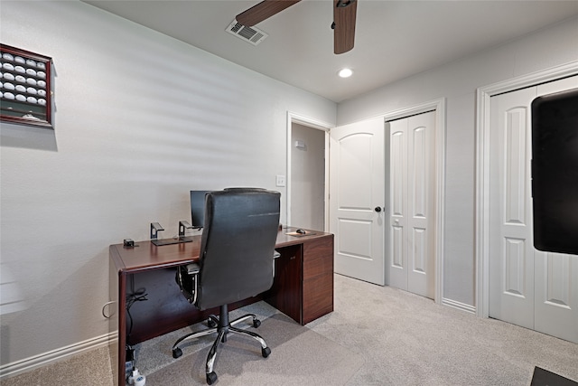 office space featuring ceiling fan and light colored carpet