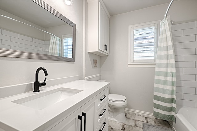 full bathroom with shower / bath combination with curtain, vanity, and toilet