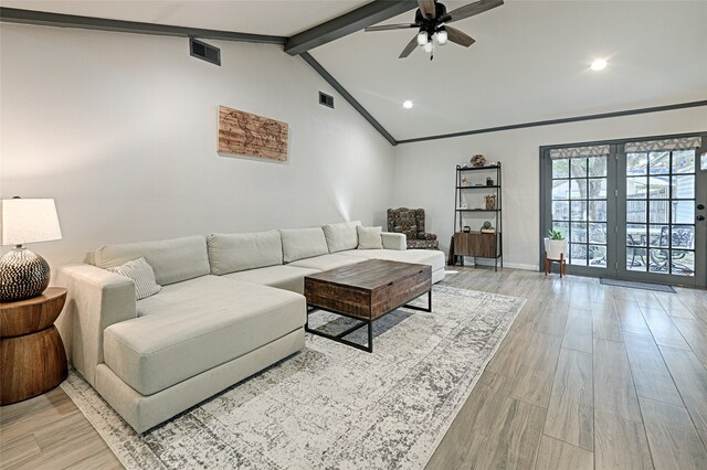 living room with light wood-type flooring, high vaulted ceiling, ceiling fan, ornamental molding, and beam ceiling