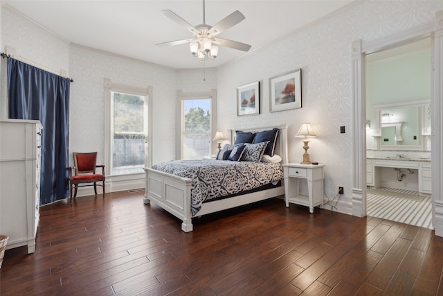 bedroom featuring ceiling fan, ornamental molding, ensuite bath, and dark wood-type flooring