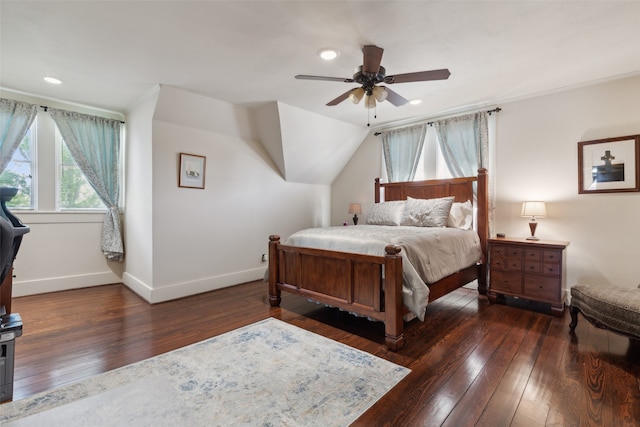 bedroom with ceiling fan and dark hardwood / wood-style floors