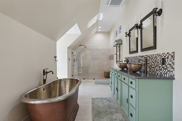 bathroom with tile patterned flooring, vanity, and independent shower and bath